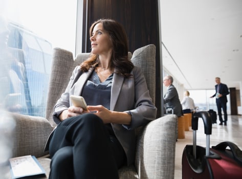 A Card Member checking the TripCase app