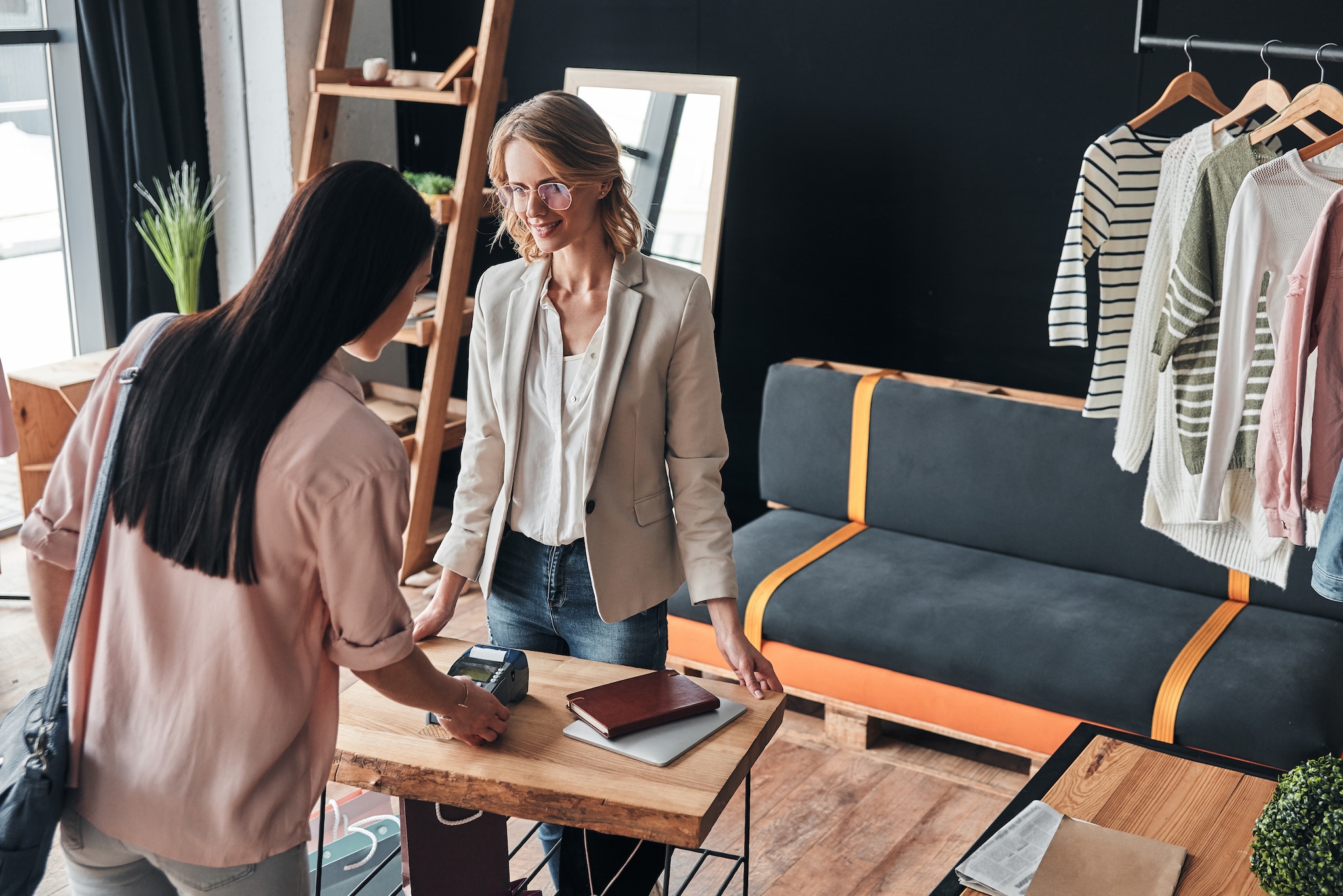  A lady entering the unique four-digit PIN to authorise the transaction.