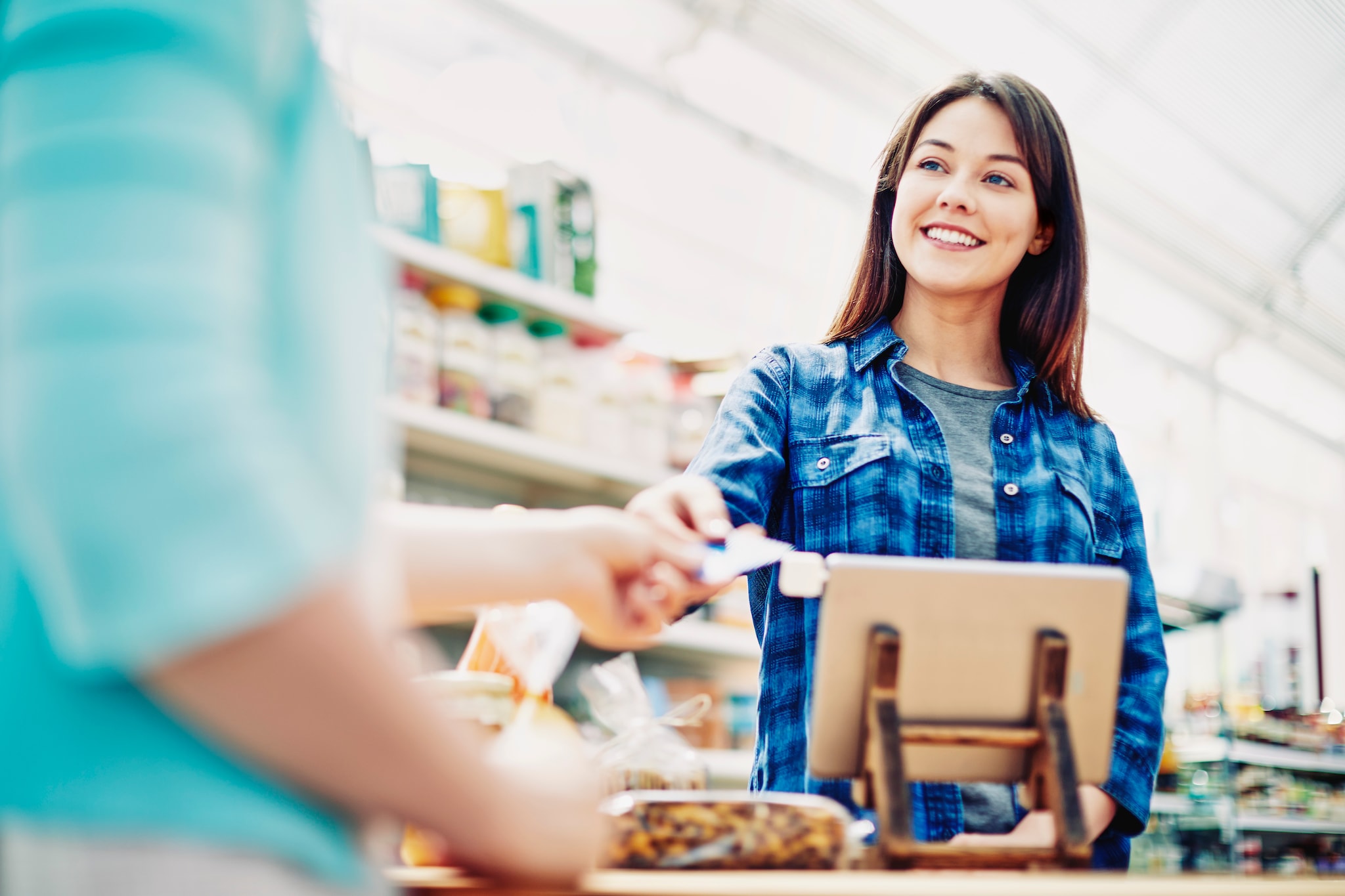  A lady receiving the receipt of the transaction.