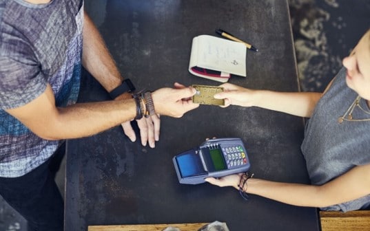 A man making payment using chip-enabled Card.