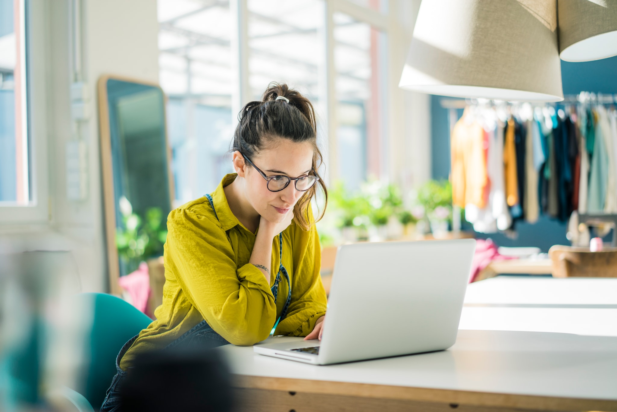  A lady looking at her laptop screen.