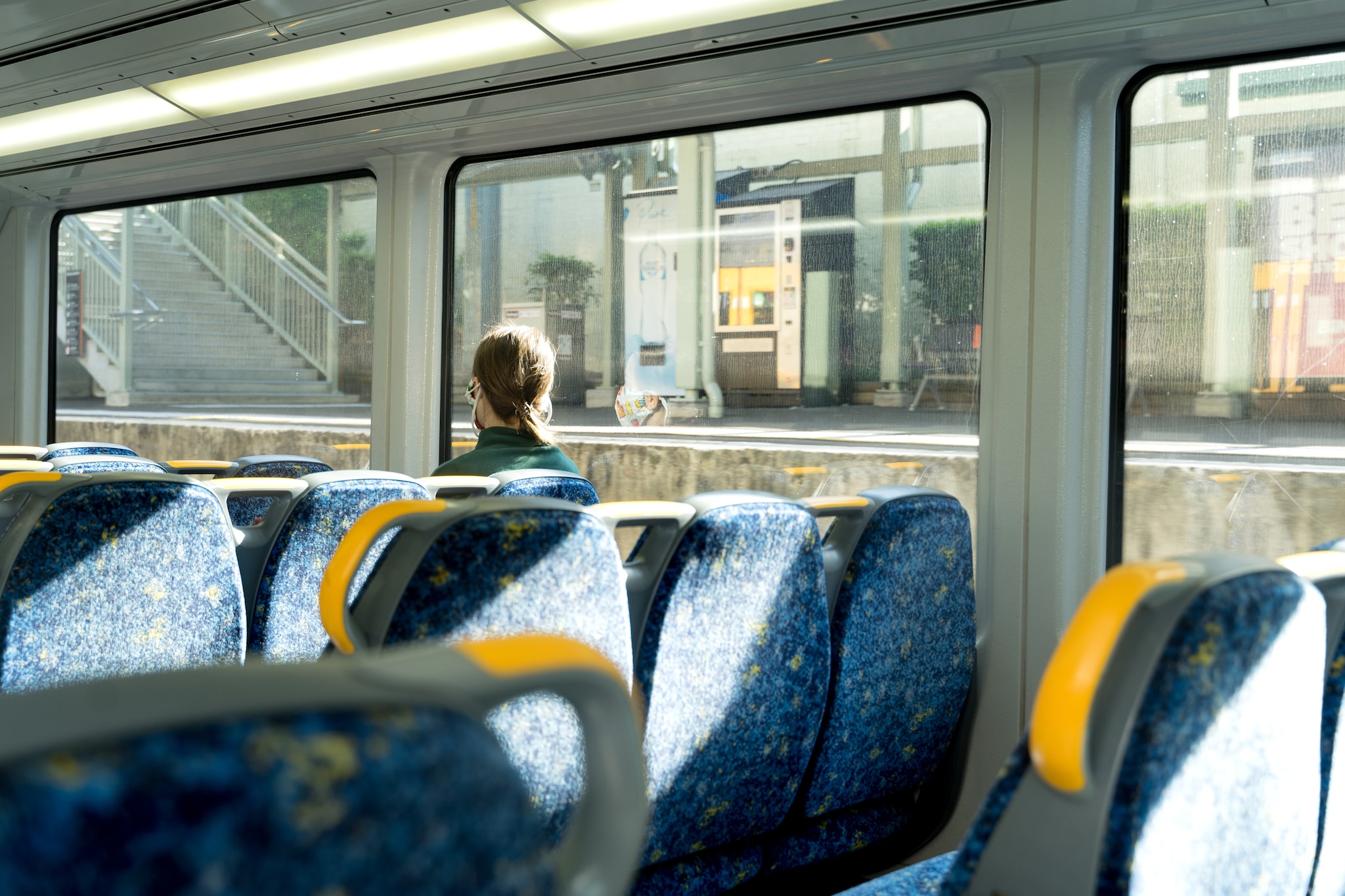   A lady listening to music while travelling.
