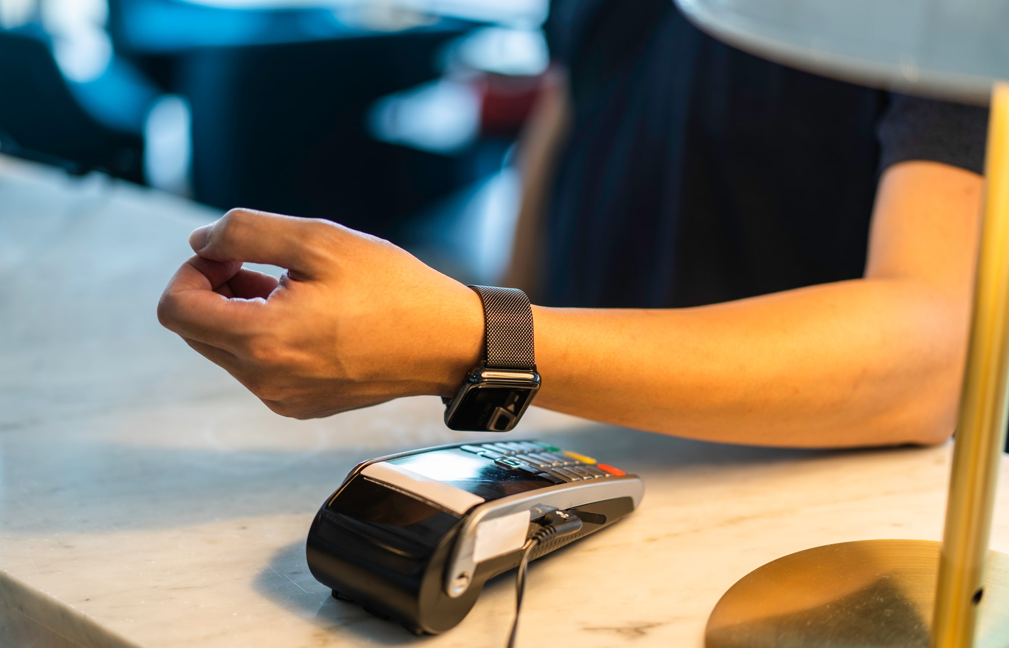 A man making payment using his wearable.