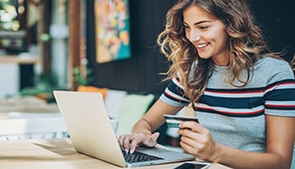 woman_using_laptop_online_shopping_with_credit_card