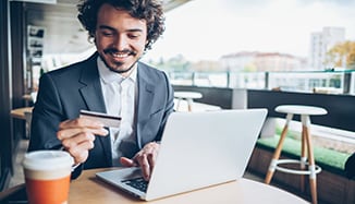 man_using_laptop_and_online_shopping_with_credit_card