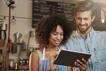 A man and woman on tablet