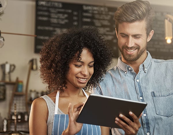 A man and woman on tablet