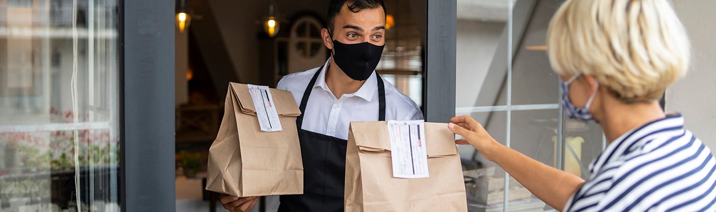 Couple eating popcorn in bed