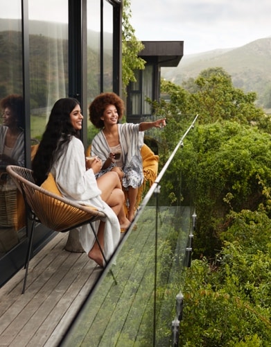 people looking out on balcony