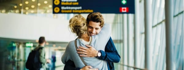  Man hugging a woman in the airport