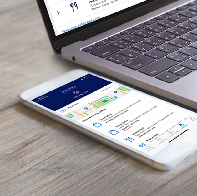 Amex Offers displayed on a mobile phone and laptop