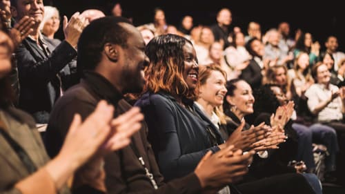 People applauding in a concert hall