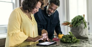 couple browsing in a tablet 