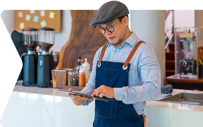 Person in coffee shop viewing device