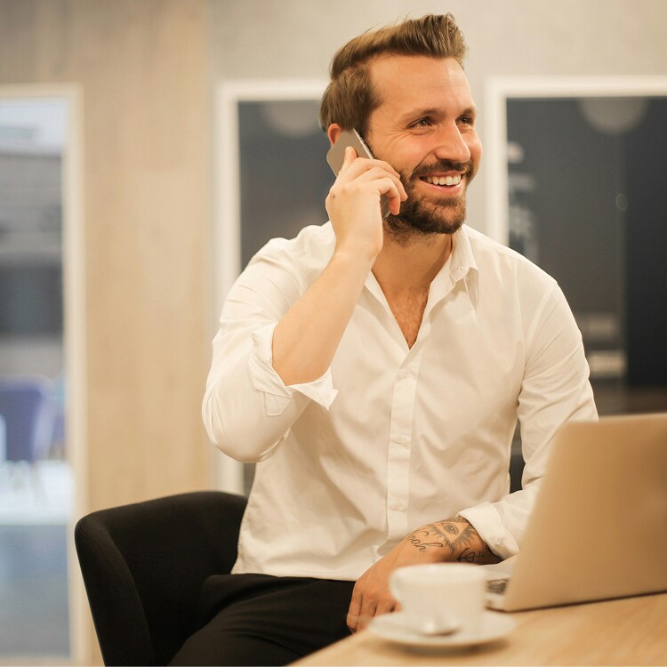 Business person at desk on phone