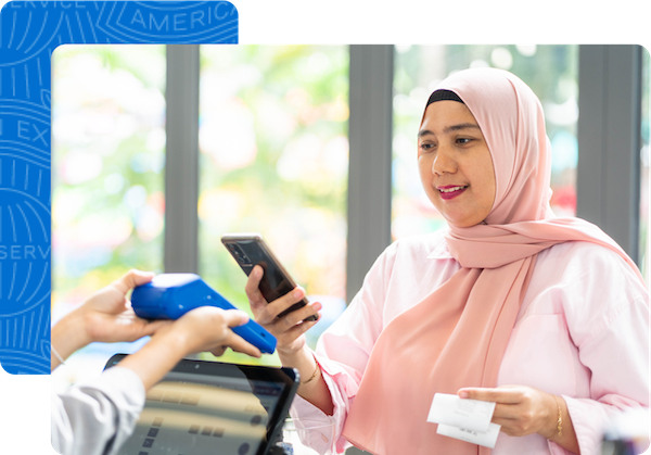 Woman using her phone to complete her purchase at a small business.