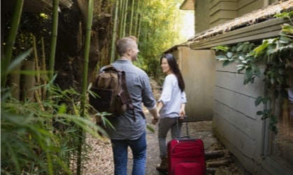 woman and man walking with a laugage