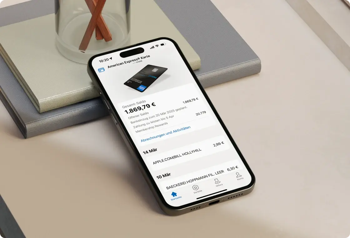 Smartphone zeigt American Express App mit geöffneter Kartenübersicht und Transaktionsdetails.