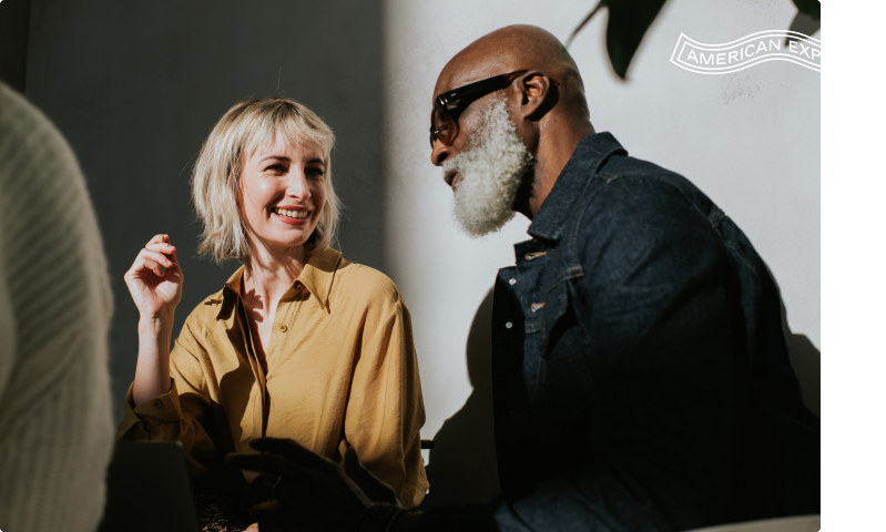 woman and man talking with each other smiling
