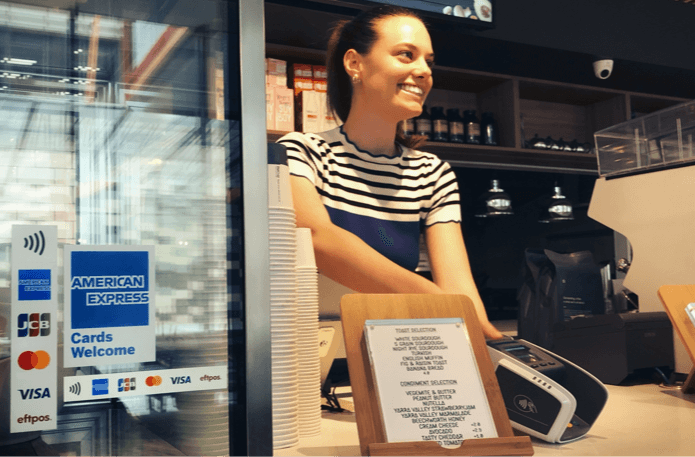 a clerk helping a customer with an order