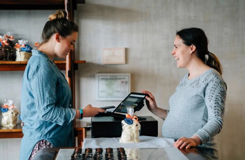 a clerk helping a customer with an order