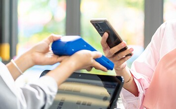 A man making payment using his wearable.