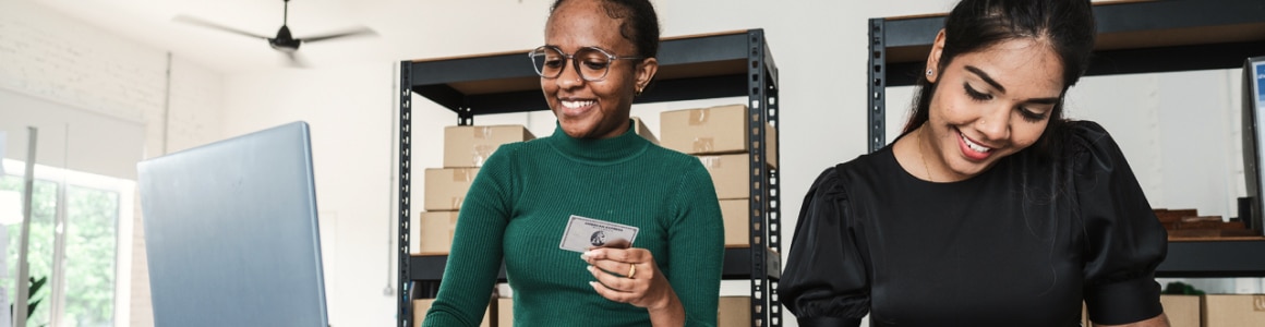 Two women smiling at office