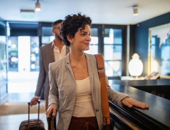 Woman smiling at hotel desk