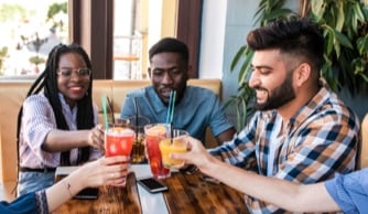 Man showing frame to woman, who looks happy