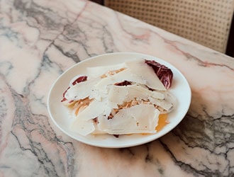 Shaved cheese on a winter salad