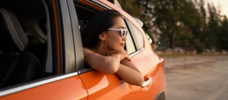 Passenger with the window rolled down.