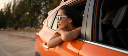 Passenger with the window rolled down.