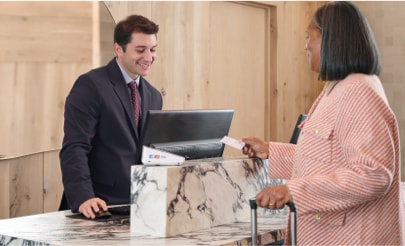 Businessperson checking into a hotel. 