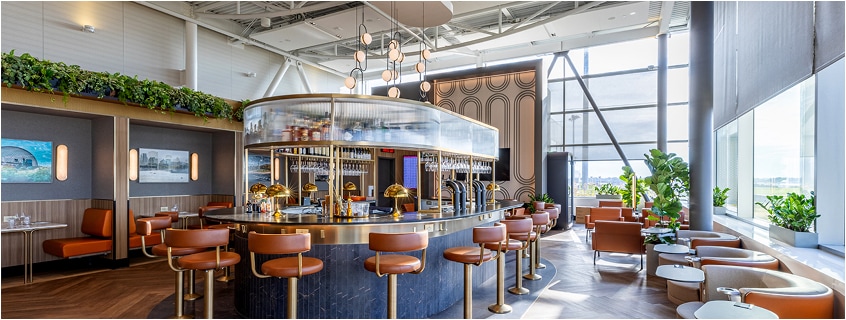 Bar and dining area in a premium lounge.