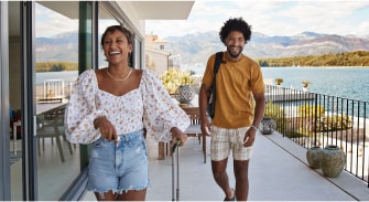 A person and person on a balcony