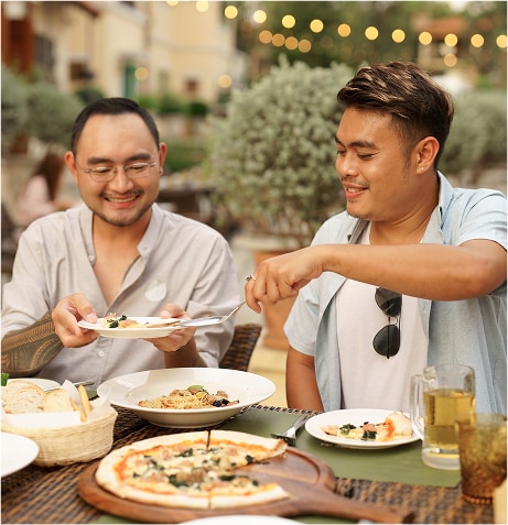 A couple of men eating 