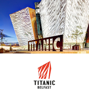 two kids running towards the camer with Warwick Castle behind them