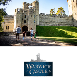 two kids running towards the camer with Warwick Castle behind them