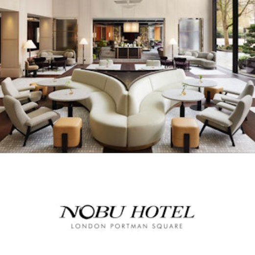Nobu Hotel, London Portman Square.  A luxurious room at the Nobu Hotel where floor to ceilings windows on the right fill the room with light. Natural materials and textures are used throughout the space.
