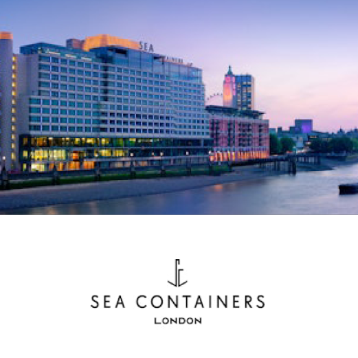 Sea Containers, London. A view of Sea Containers Hotel. A lovely pink and blue sky of early evening sits behind the impressive hotel sitting on the riverfront.