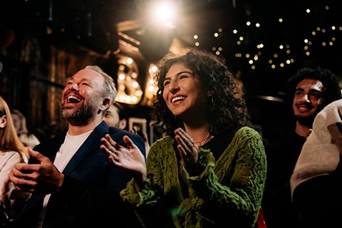 two people watching live theatre performance