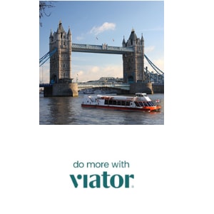 two kids running towards the camer with Warwick Castle behind them