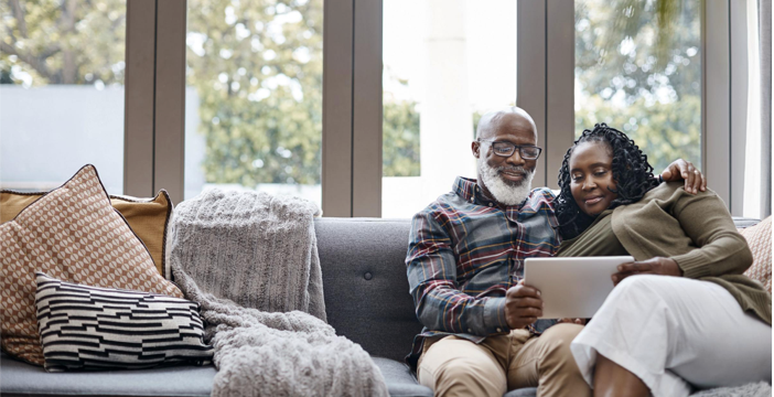 Couple holding a device