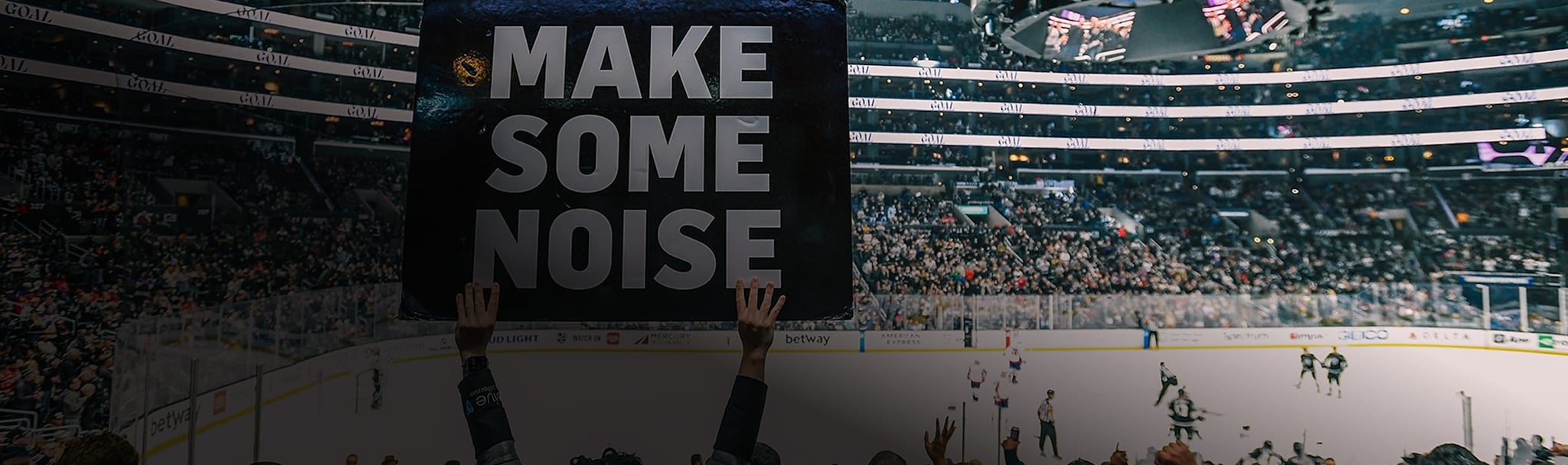 Make some noise sign in crowd