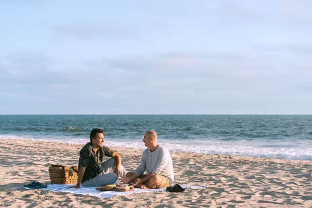 People enjoying a picnic on the beach