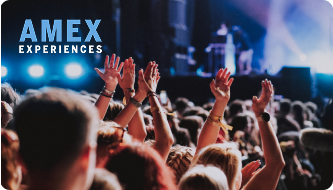 Crowd at a gig with their hands in the air, Amex Experiences logo in the top left corner