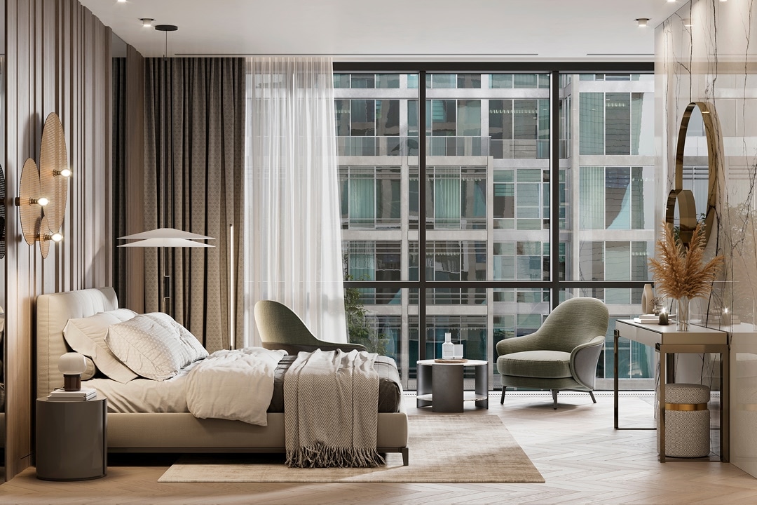 Bright hotel room with bed, chairs and a view of city buildings
