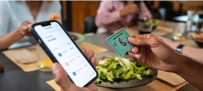 Person pays for a meal in a restaurant