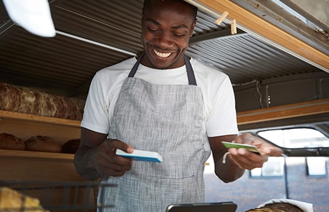 Person working in restaurant completes a transaction