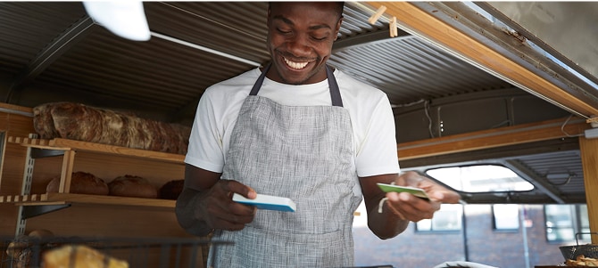 Person working in restaurant completes a transaction